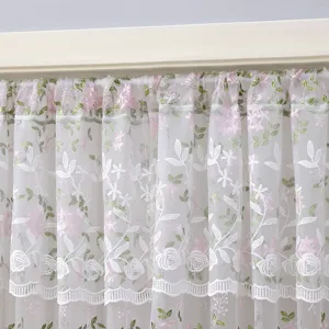 Embroidery floral sheer curtain detail, sheer mesh fabric with pink roses and green leaves.