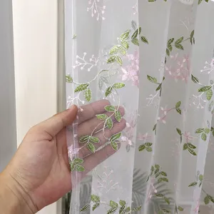 Sheer embroidered door curtain detail view, lightweight translucent tulle fabric with floral motif.
