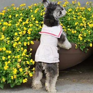 Detailed view of the cute pink sailor collar pet dress, showing soft breathable fabric.