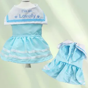 Pet sailor dress detail showing blue and white fabric with cute chest text and pleated skirt.
