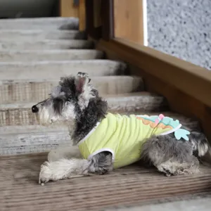 Detailed view of a cute summer pet vest with cartoon dinosaur design for small dogs breathable.