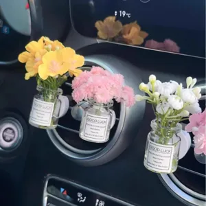 Car air vent perfume clip with artificial flowers, cute auto interior decoration.