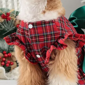 Cute red plaid dog Christmas dress with green bow, festive pet apparel for small dogs.