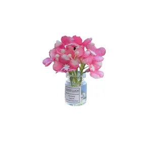Car air vent perfume bottle with pink flowers, aromatherapy diffuser clip for auto interior.