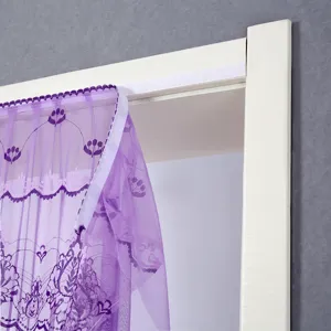 Detail of purple lace door curtain with floral embroidery and velcro installation for home decor.