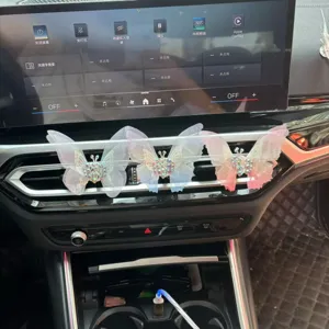 Detailed view of rhinestone mesh butterfly car air vent clips, decorative interior charm.