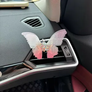 Car air vent butterfly decor detail, sparkling rhinestone pink butterfly car ornament charm.