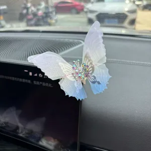 Car butterfly ornament detail shot showing exquisite rhinestone mesh wings for vehicle interior decor.