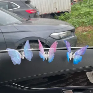 Cute butterfly car air vent clips, mesh wings pearl decor, stylish interior aesthetic charm.