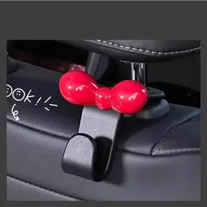 Cute bow car hook for back seat, aesthetic pink car interior accessory and storage organizer.