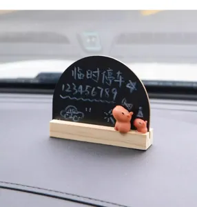 Detail view showing the cute capybara wooden blackboard temporary car parking phone number sign.