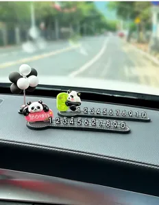 Close-up of cute panda car temporary parking card interior ornament with number display.