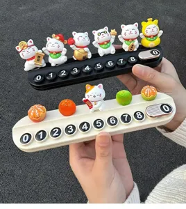 Close-up detail of cute lucky cat car temporary parking sign with hidden number buttons.
