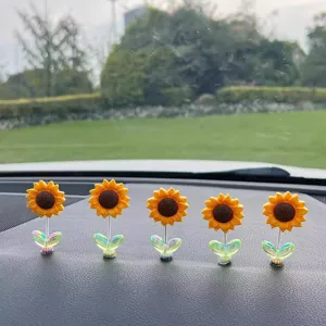Cute sunflower car dashboard bobblehead ornament set, vibrant spring shaking flower decor.