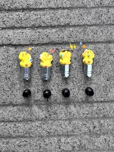 Cute yellow duck bicycle tire valve caps set, metal stem covers for bike and vehicle tires.
