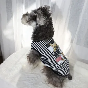 Detailed view of striped pet vest for dogs, featuring cute puppy graphic print and breathable fabric.