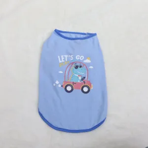 Close-up detail of blue pet vest featuring cute cartoon dinosaur driving car print and edges.