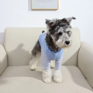 Blue white striped dog vest detail showing soft fabric and cute dinosaur print.