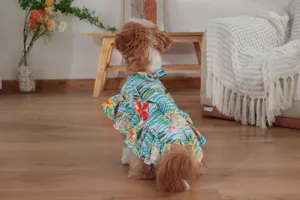 Detailed view of the tropical floral pet cape dress, featuring sweet ruffles and bow.