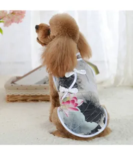 Pet detail shot showing Chinese style lotus print dog cheongsam dress with cute frog buttons.
