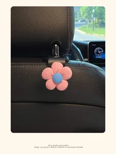 Leuke autostoel hoofdsteun haak met roze bloem, praktische opbergorganizer voor in de auto.