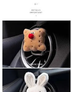 Plush biscuit car air vent clip detail, cute cartoon aromatic ornament close-up view.