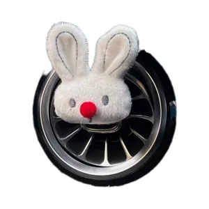 Cute plush rabbit car air vent clip diffuser, soft white bunny decor with red nose for auto interior.