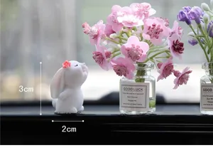Cute car dashboard ornament set featuring a resin rabbit figurine and miniature flower vase decor.