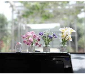 Cute car dashboard ornament set with mini glass vases, artificial flowers and a rabbit figurine.
