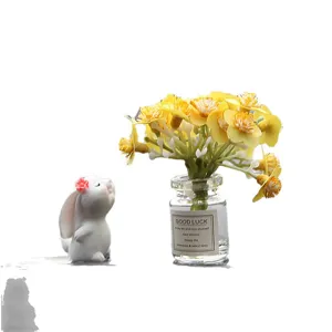 Cute rabbit and yellow flower glass bottle car dashboard ornament, lovely desk decoration.