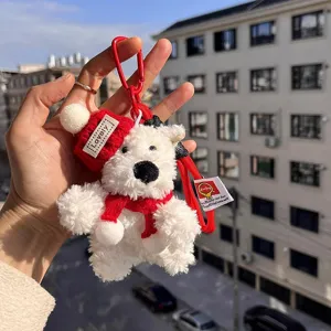 White plush puppy key chain with red knit hat and scarf, cute bag pendant accessory.