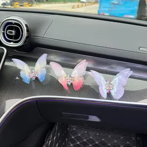 Embroidered butterfly car air vent decoration with sparkling rhinestones for car interior.