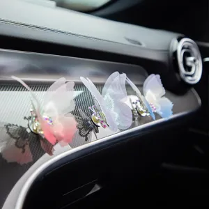 Car air vent butterfly decoration, moving embroidered mesh vehicle ornament for interior aesthetics.
