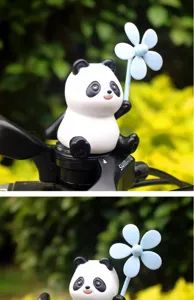 Cute panda pinwheel toy detail showing exquisite craftsmanship and rotating blue blade for bike.