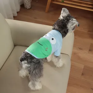 Detail shot of pet summer cartoon frog t-shirt worn by a small dog on a sofa showcase.