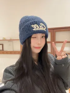 Korean style dark blue knit beanie with white letter embroidery for autumn winter warmth.