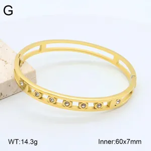 Bracelet jonc ouvert en acier inoxydable doré avec des pierres zirconium, taille 60x7mm.