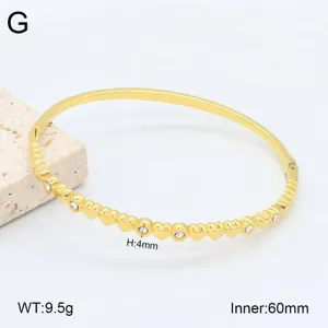 Bracelet jonc en acier inoxydable plaqué or avec cœur, vue détaillée et dimensions.