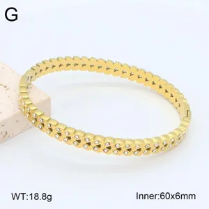 Superbe bracelet jonc cœur en acier inoxydable doré avec strass, détail 60x6mm.