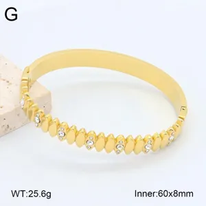 Bracelet jonc en acier inoxydable doré, détails géométriques incrustés de strass, 60x8mm.