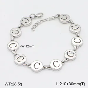 Bracelet en acier inoxydable avec pendentifs ronds polis, longueur ajustable élégant.