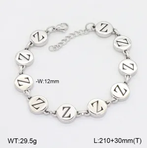 Bracelet en acier inoxydable avec des disques ronds lettre Z et chaîne d'extension élégante.
