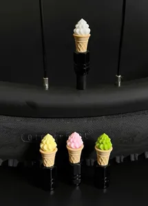 Detailed shot of cute ice cream bicycle valve caps, colorful tire accessories for mountain bikes.