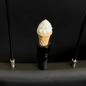 Ice cream cone bicycle tire valve cap detail, cute dust cover close up display view.