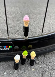 Close-up detail of cute ice cream cone bicycle tire valve caps, durable and stylish.