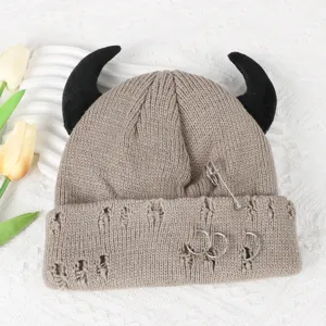Distressed knit beanie with devil horns, punk style winter wool hat with pins and rings