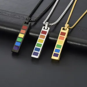 Detailed view of three rainbow vertical bar pendants in black, silver, and gold finishes