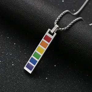 Macro detail view of rainbow enamel vertical bar pendant necklace on steel box chain
