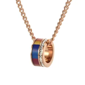 Close-up of rainbow striped ring pendant with crystals on a rose gold chain
