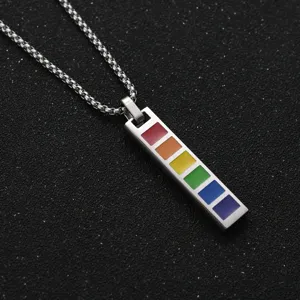 Detailed view of stainless steel rainbow bar pendant necklace with six colored squares